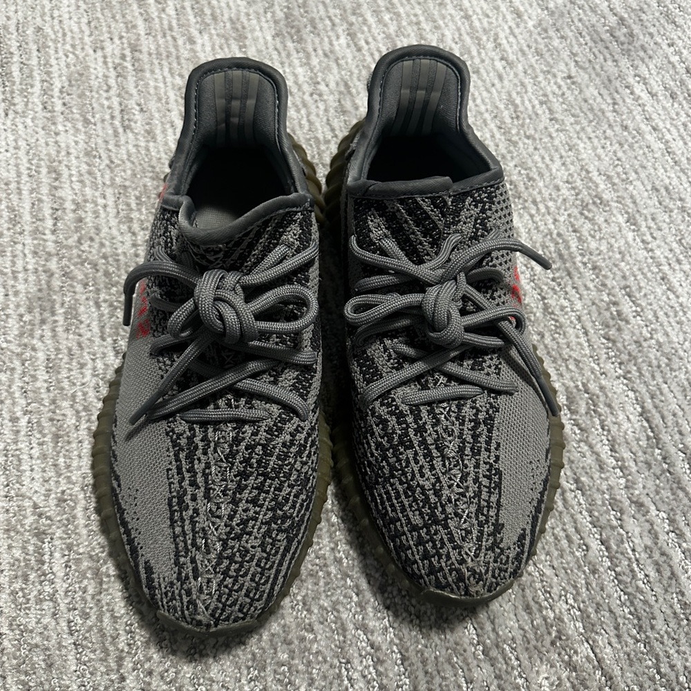 124. YEEZY Authentic Black and Red Knit Sneakers.